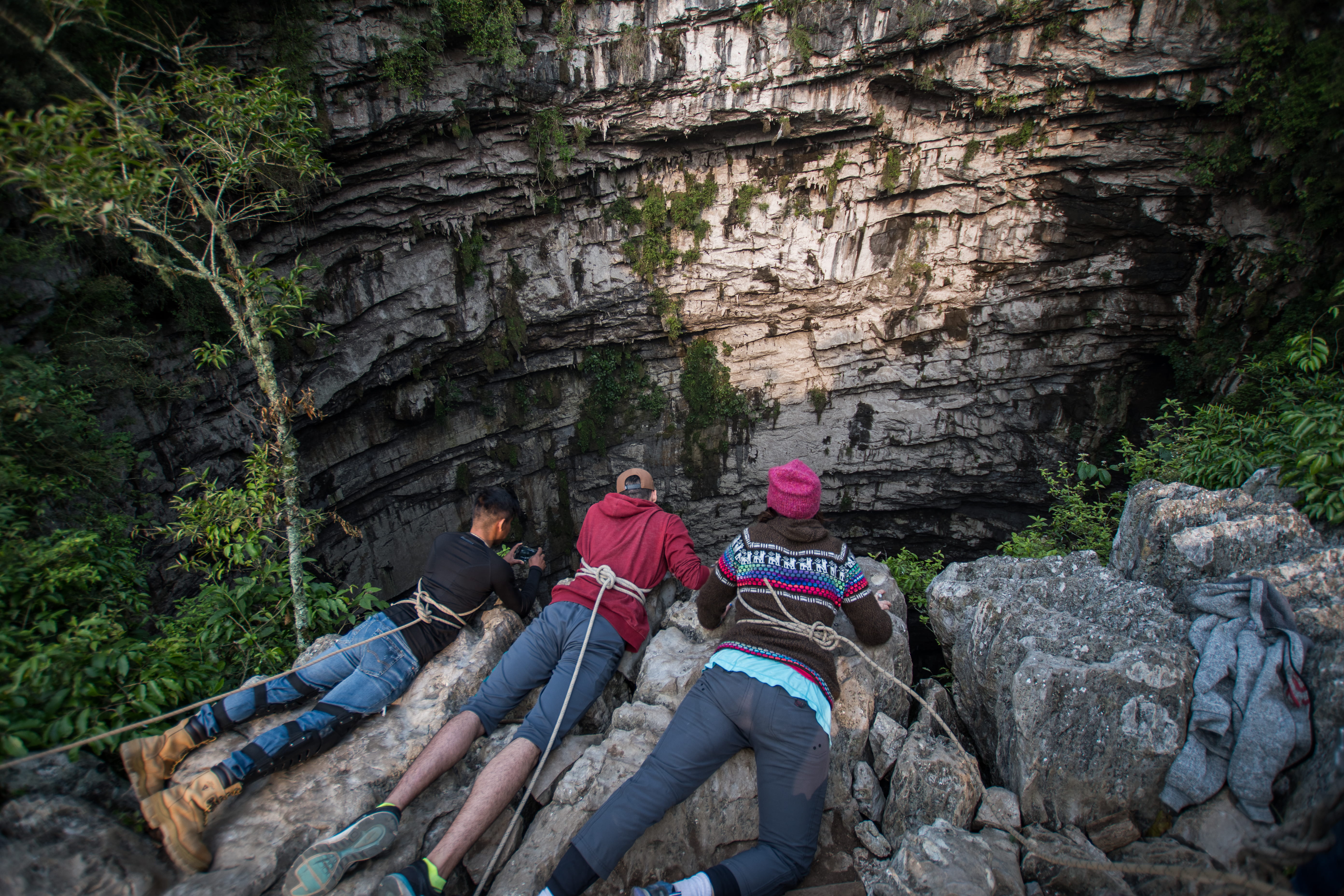 three people lying on boulders, rock, solid, rock - object, rock formation