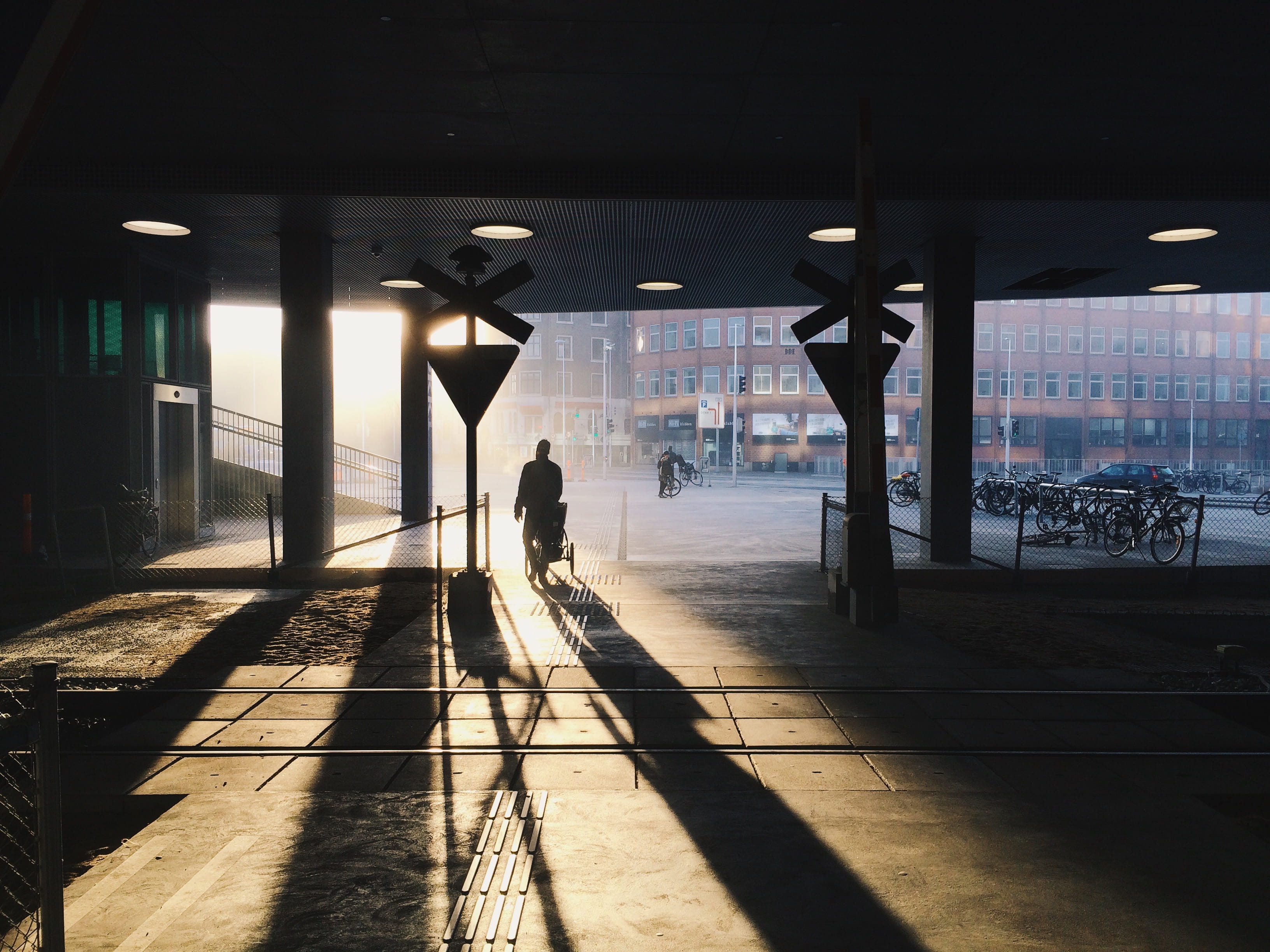 man standing with shadow, architecture, built structure, real people