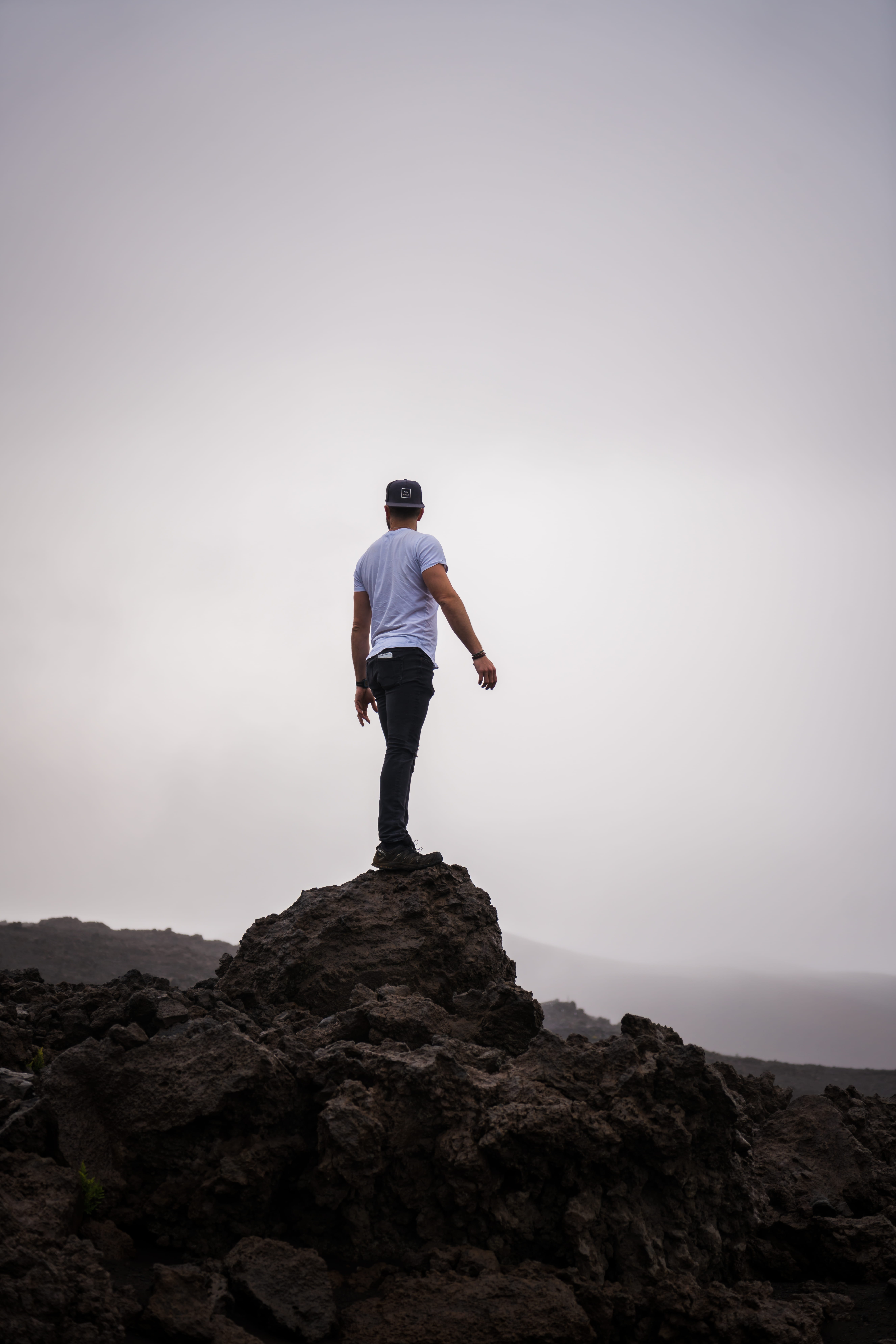 men's black pants, rock, rock - object, solid, one person, standing