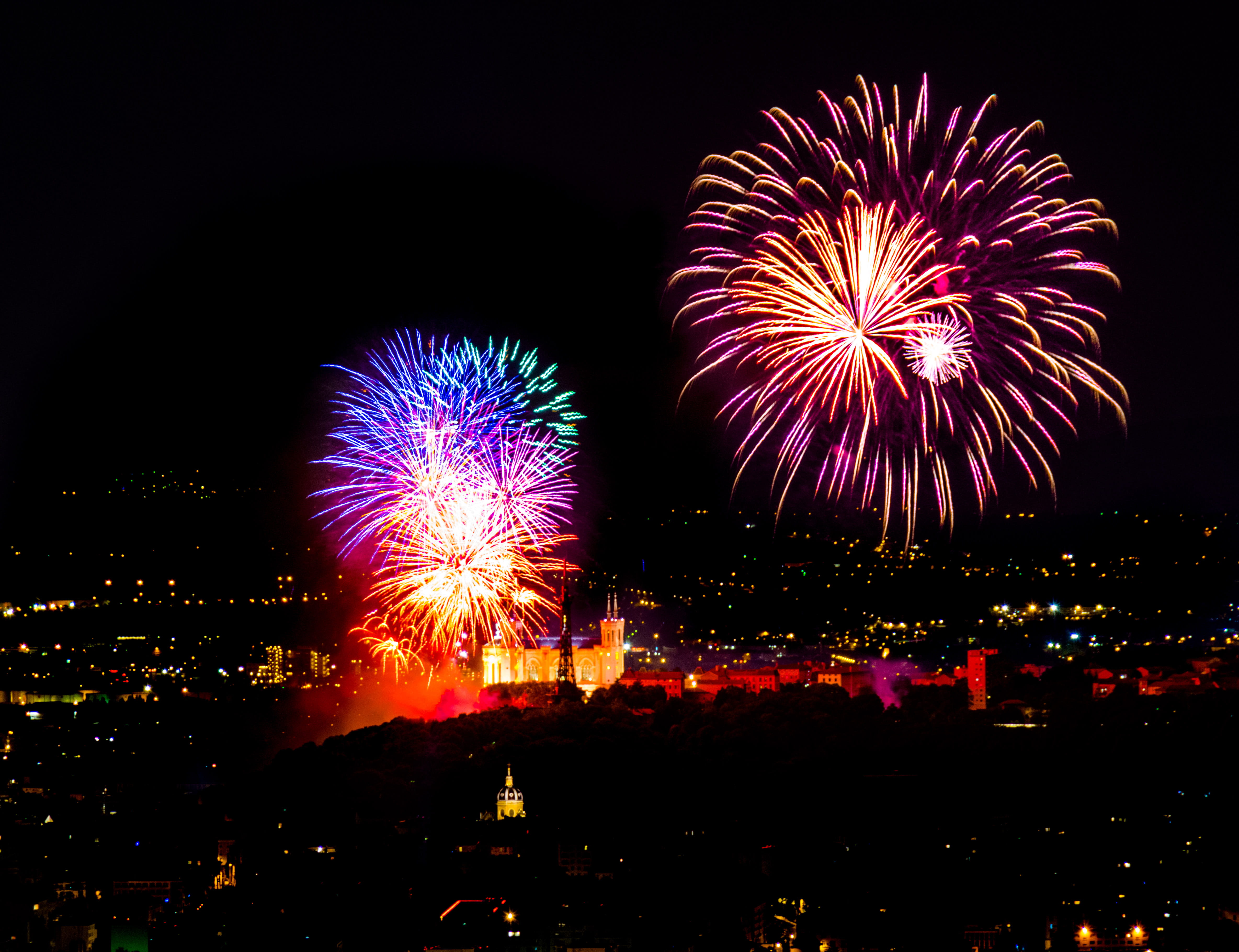 A colorful fireworks display at night in France., lyon, 14 juillet