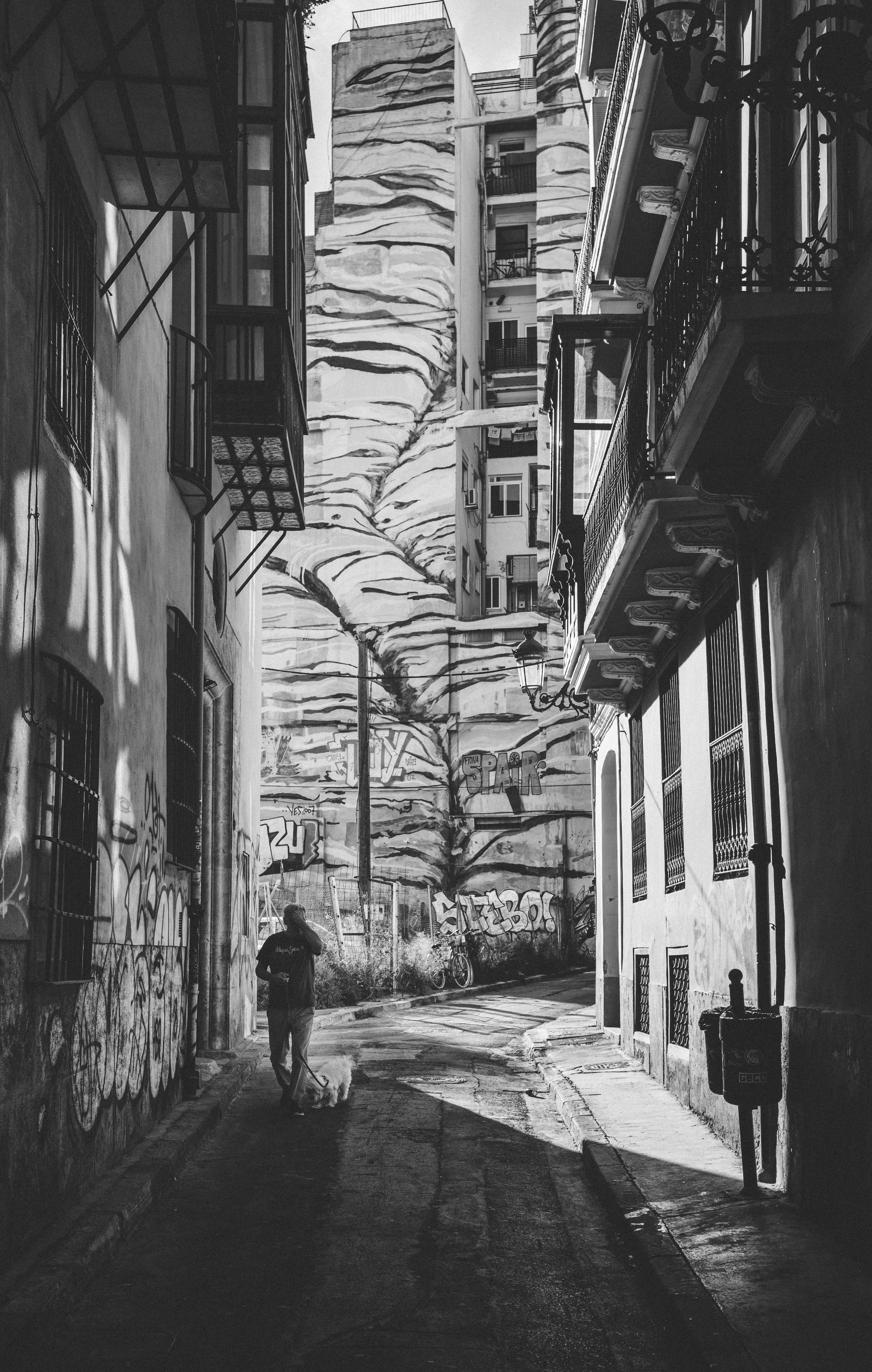 grayscale photography of person walking, urban, road, street