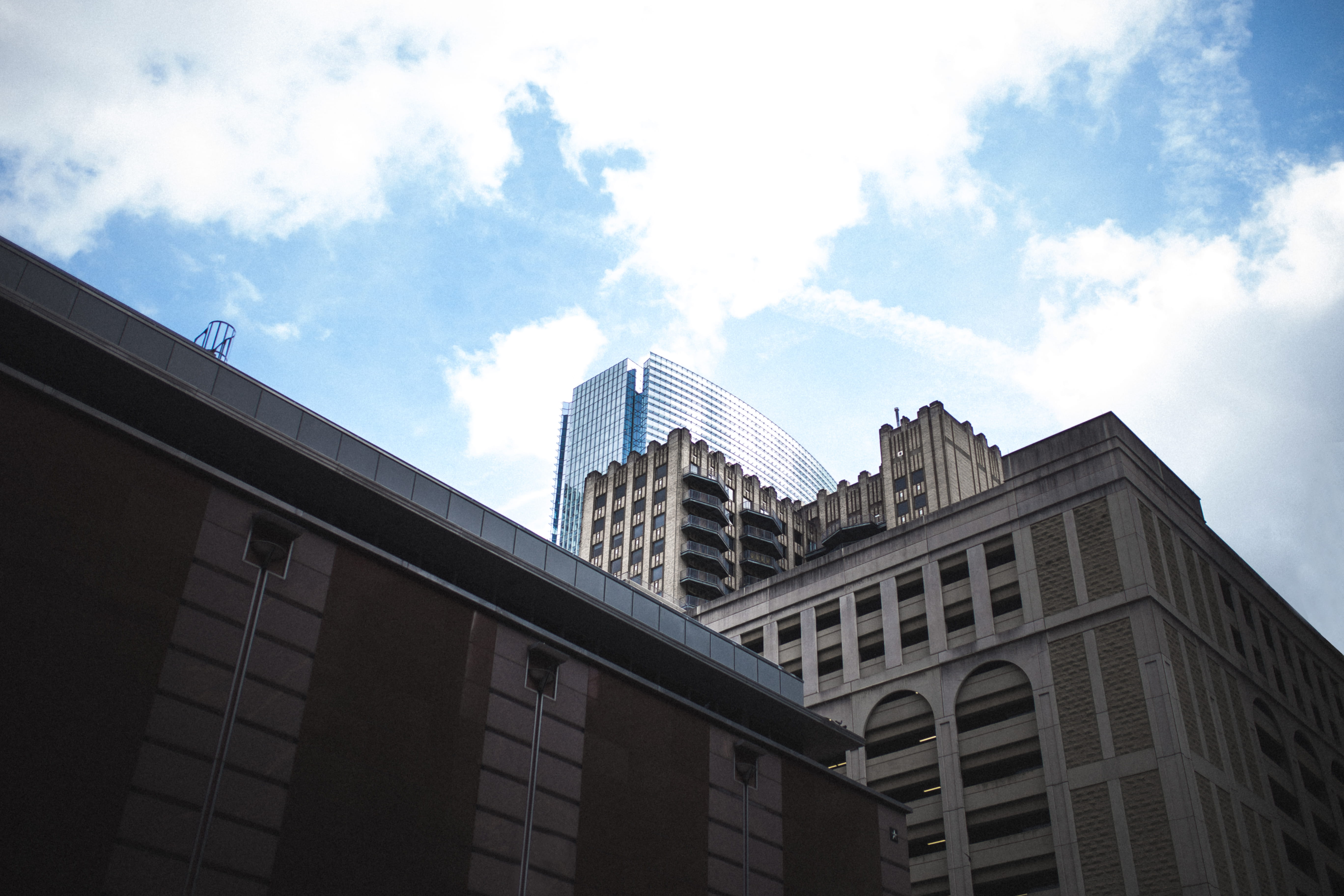 brown concrete building under white clouds, architecture, built structure