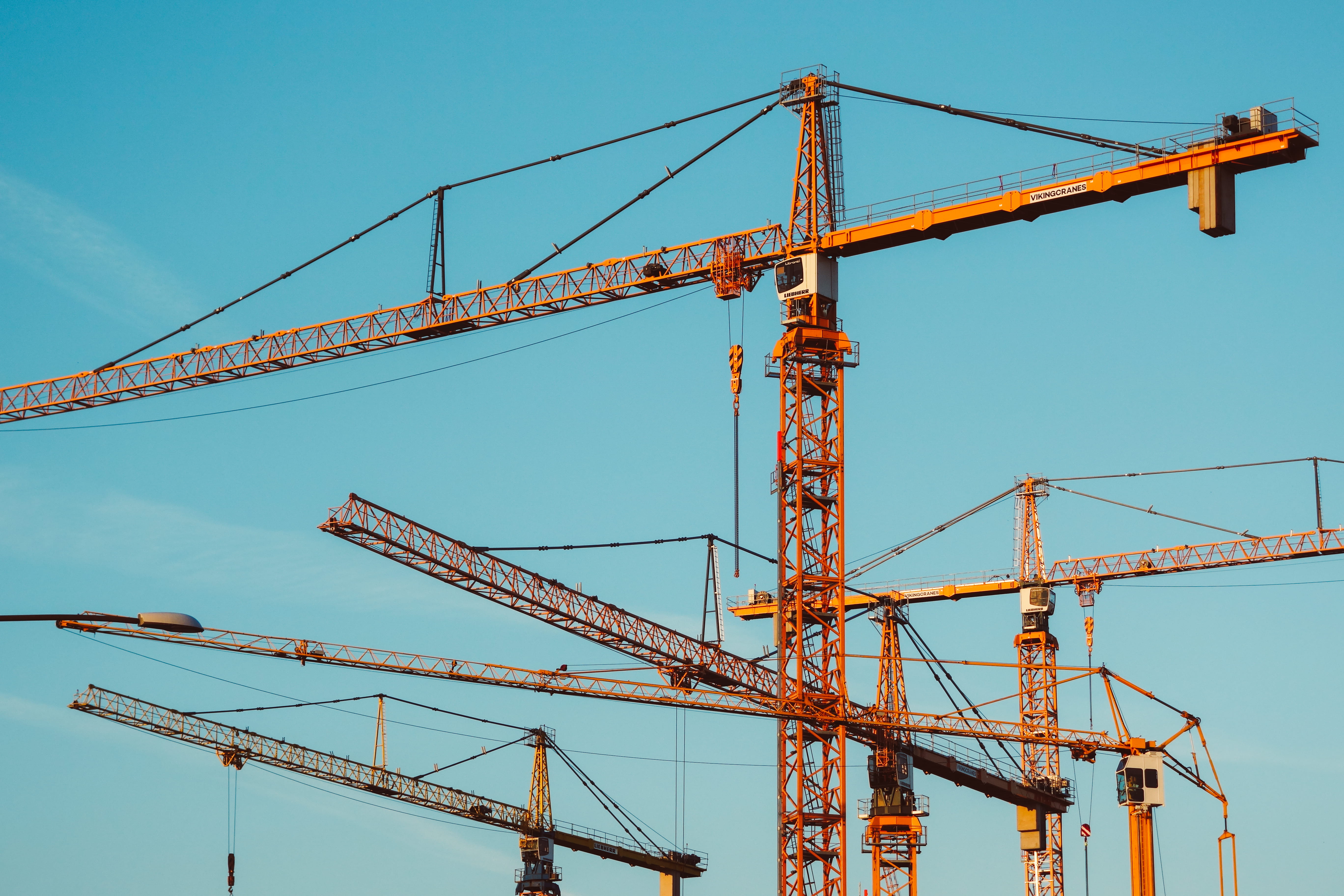 brown tower cranes, construction site, construction industry