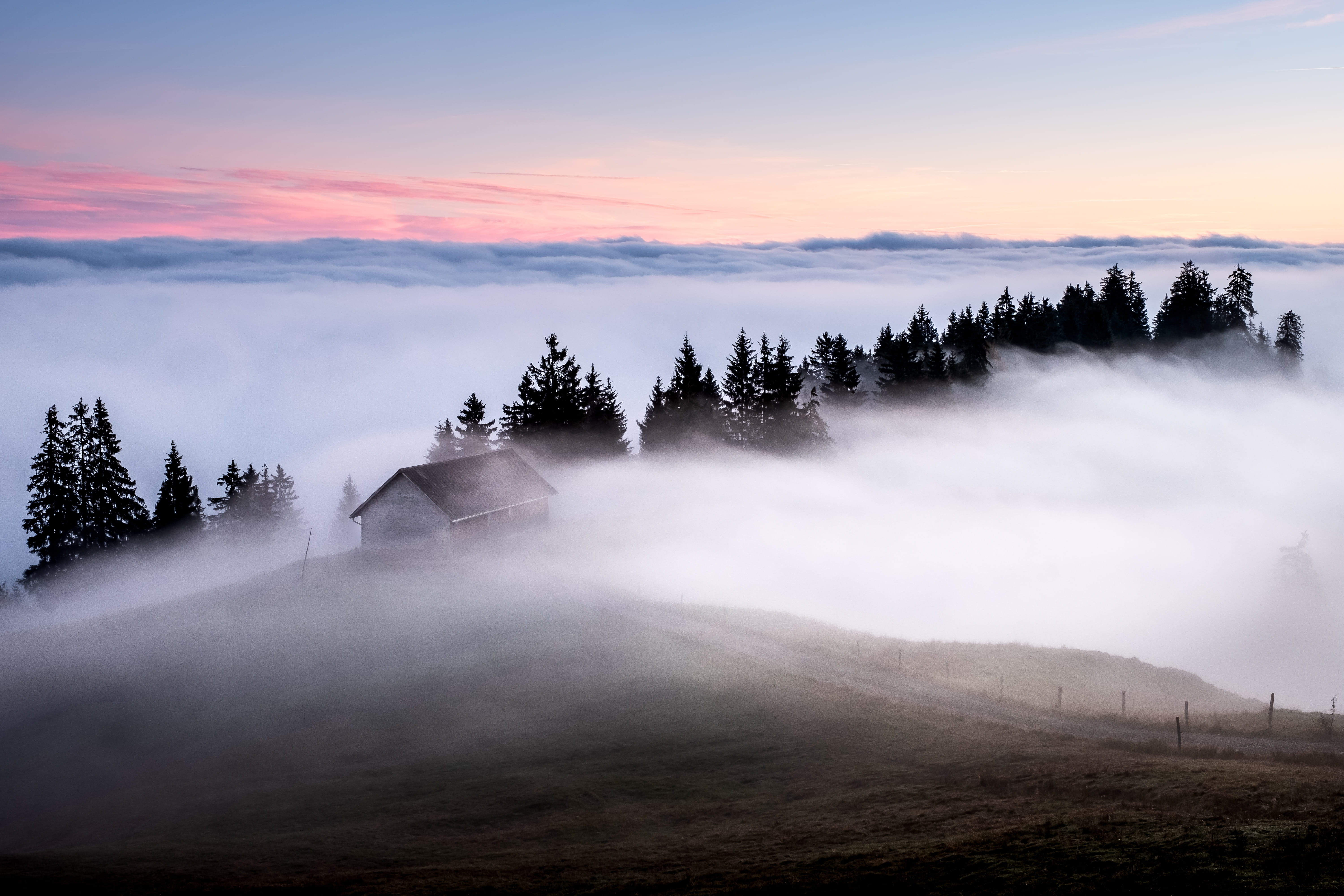 white and brown wooden house surrounded by fogs, mist, morning