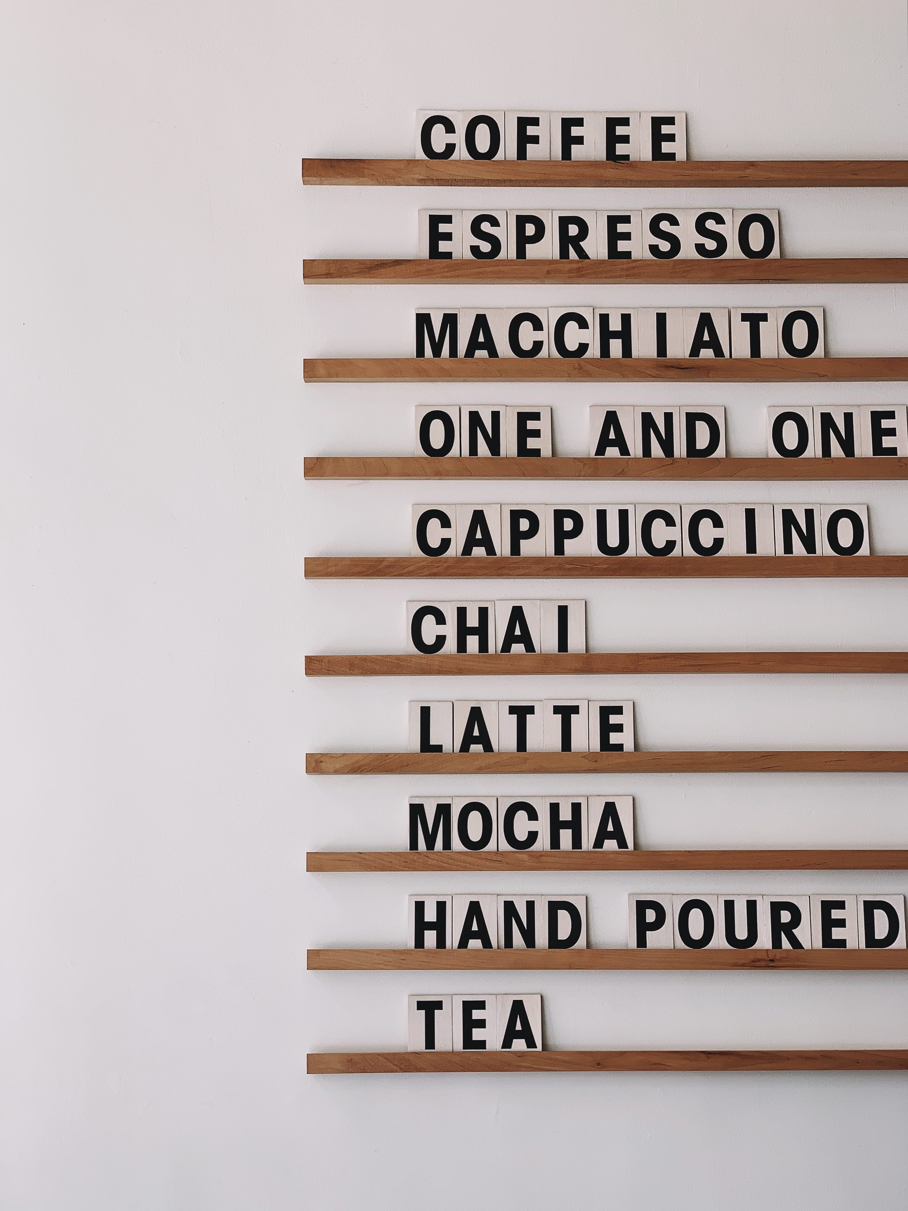 drinks wall decor, text, communication, indoors, western script