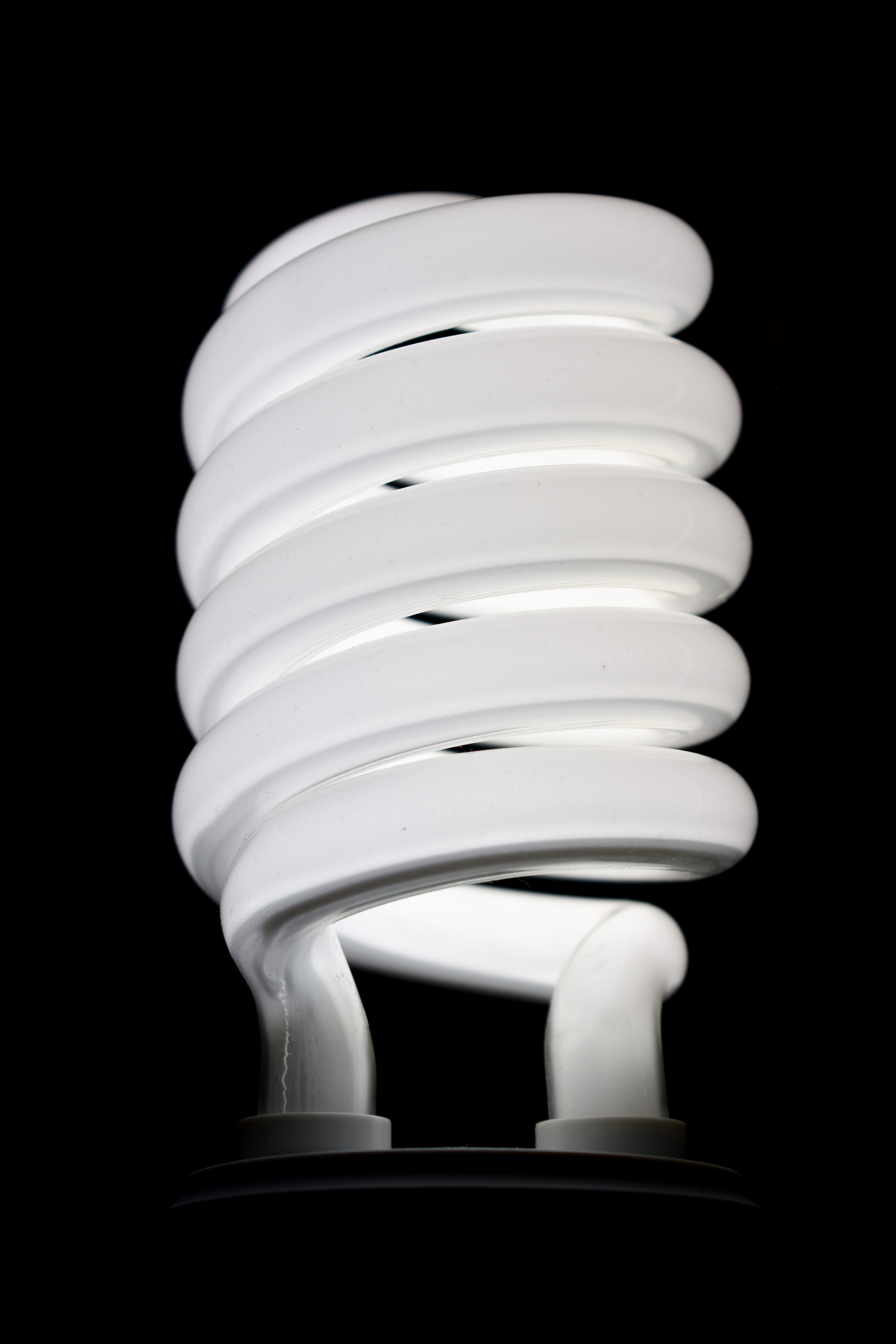 swirl light bulb, black background, studio shot, energy efficient
