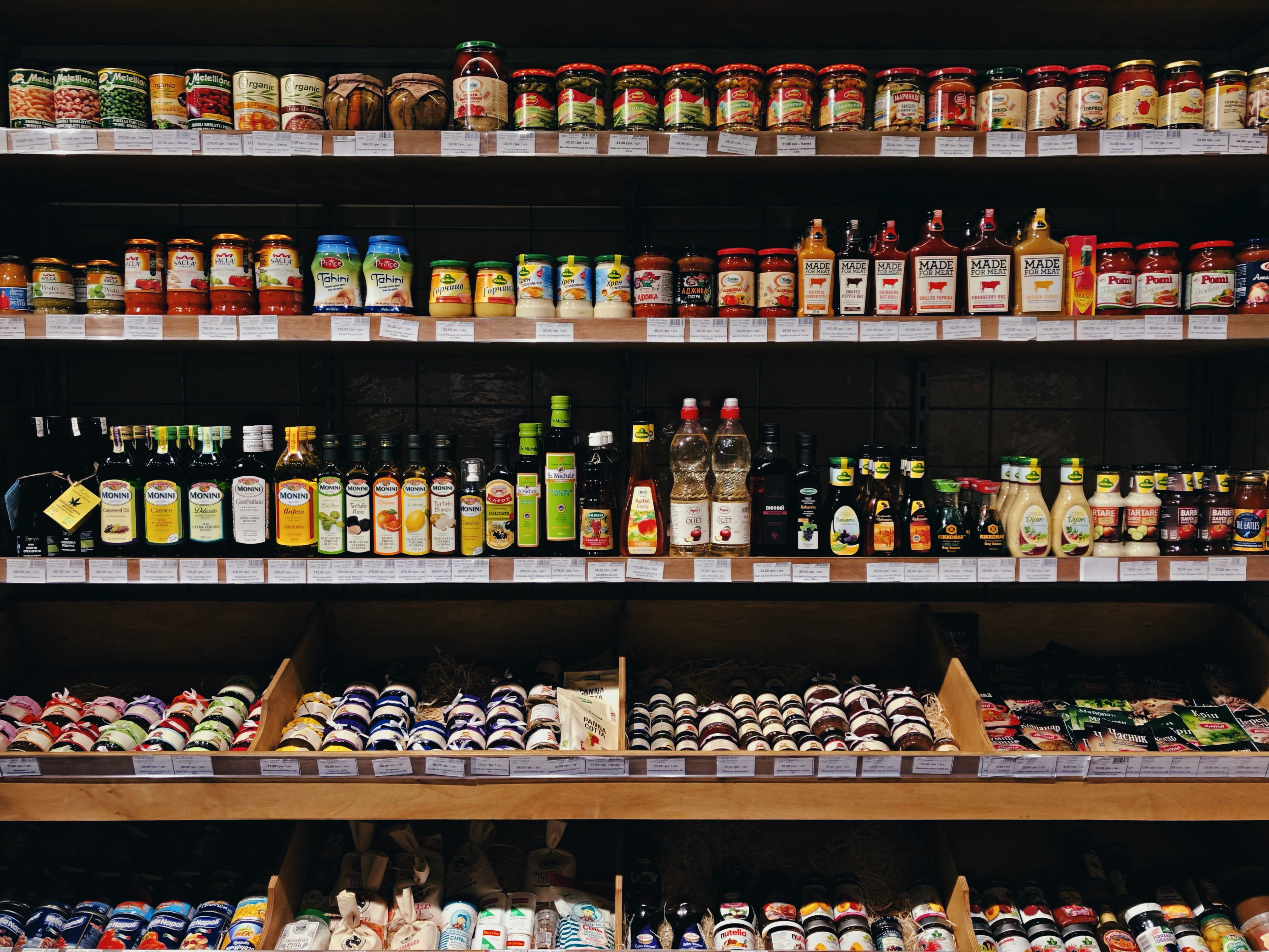 assorted-labeled bottle display on rack, choice, variation, shelf