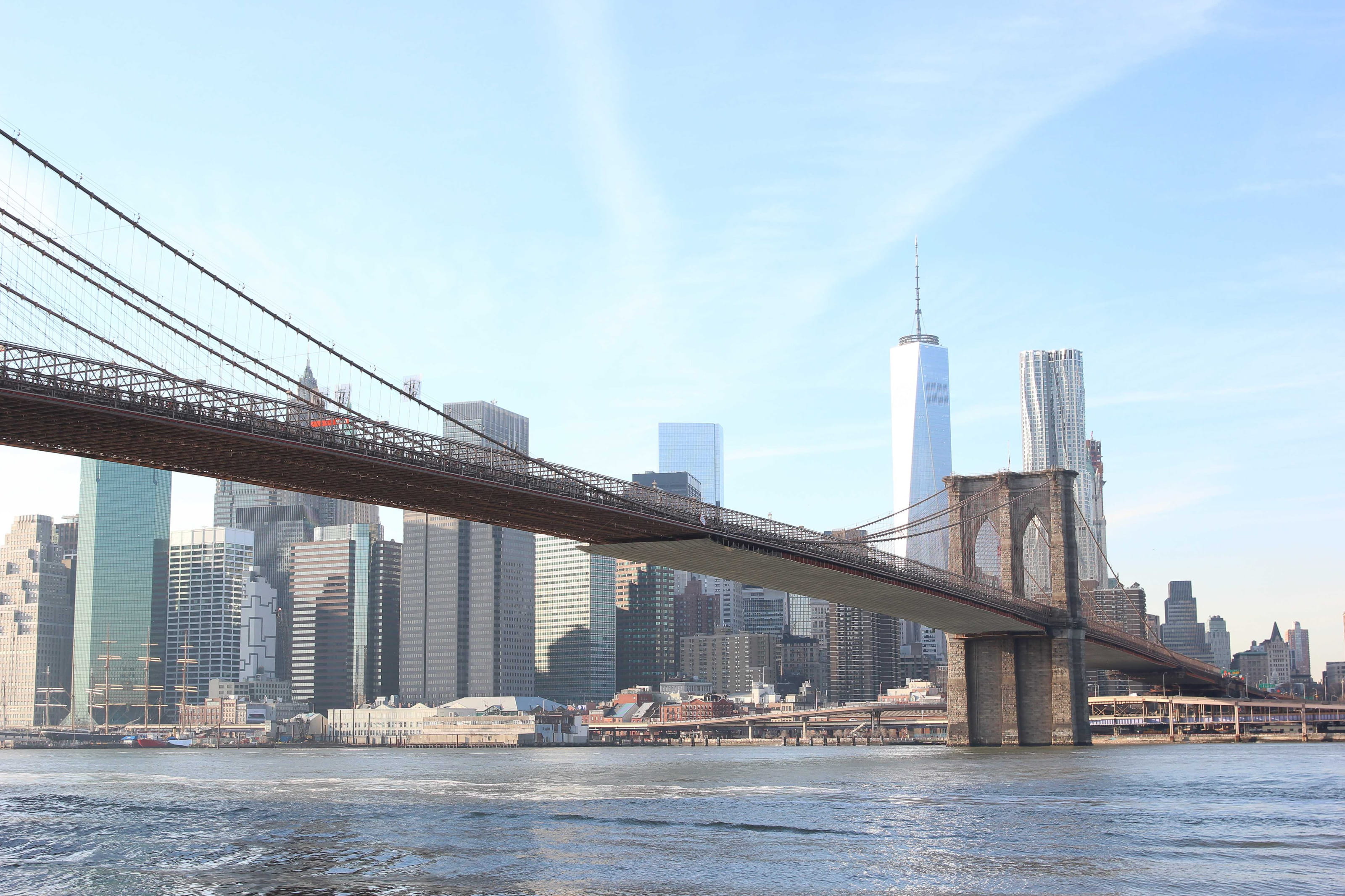 The Brooklyn Bridge connects the boroughs of Manhattan and Brooklyn, spanning the East River.