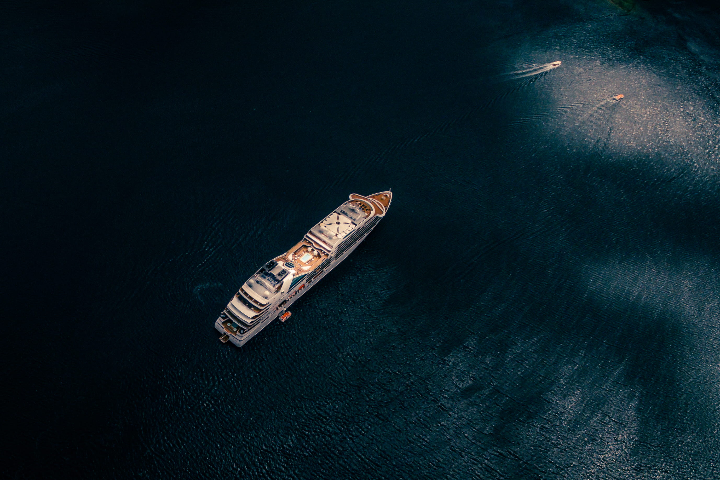 cruise ship on body of water, kotor, montenegro, aerial view