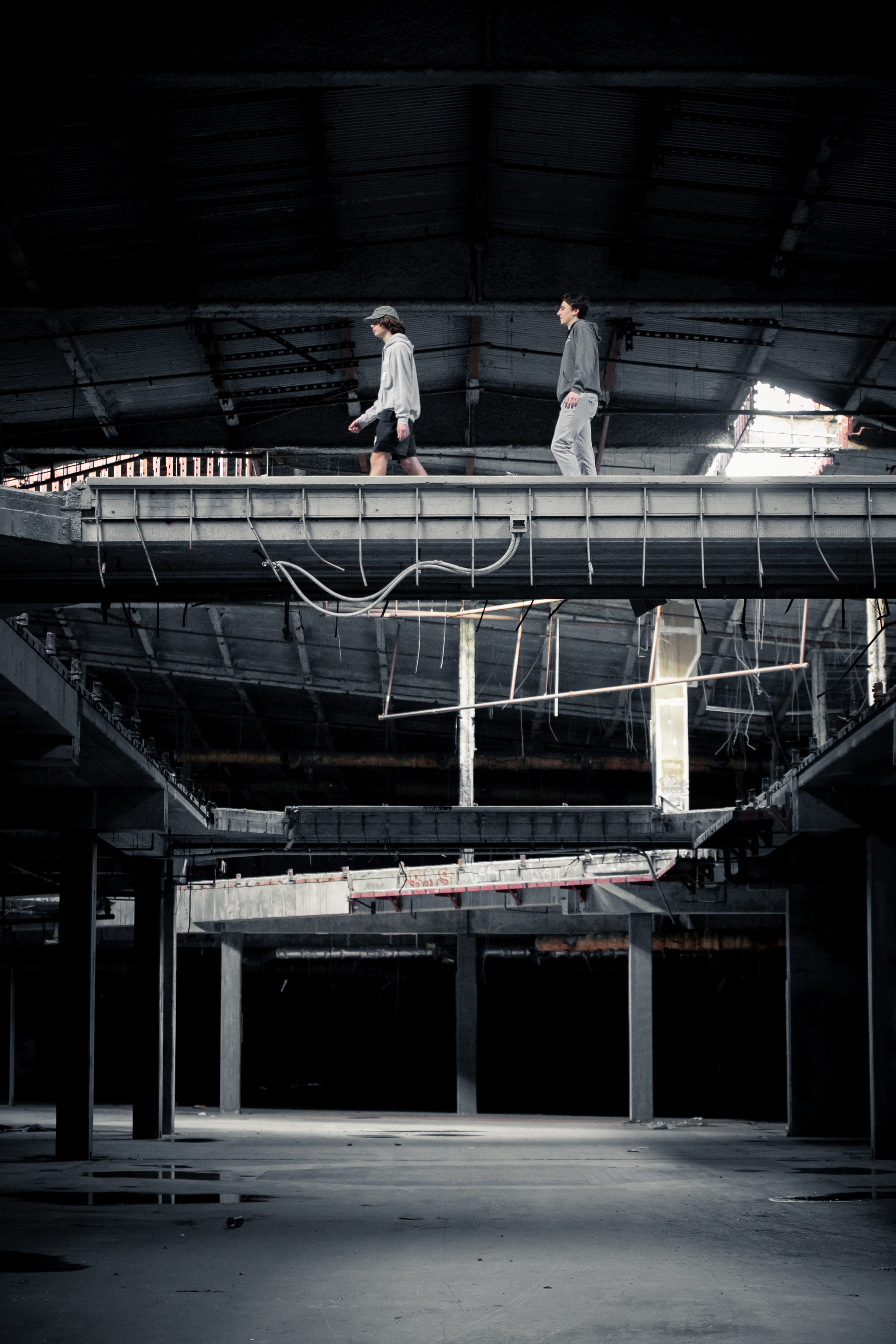 two men walking inside building, architecture, built structure