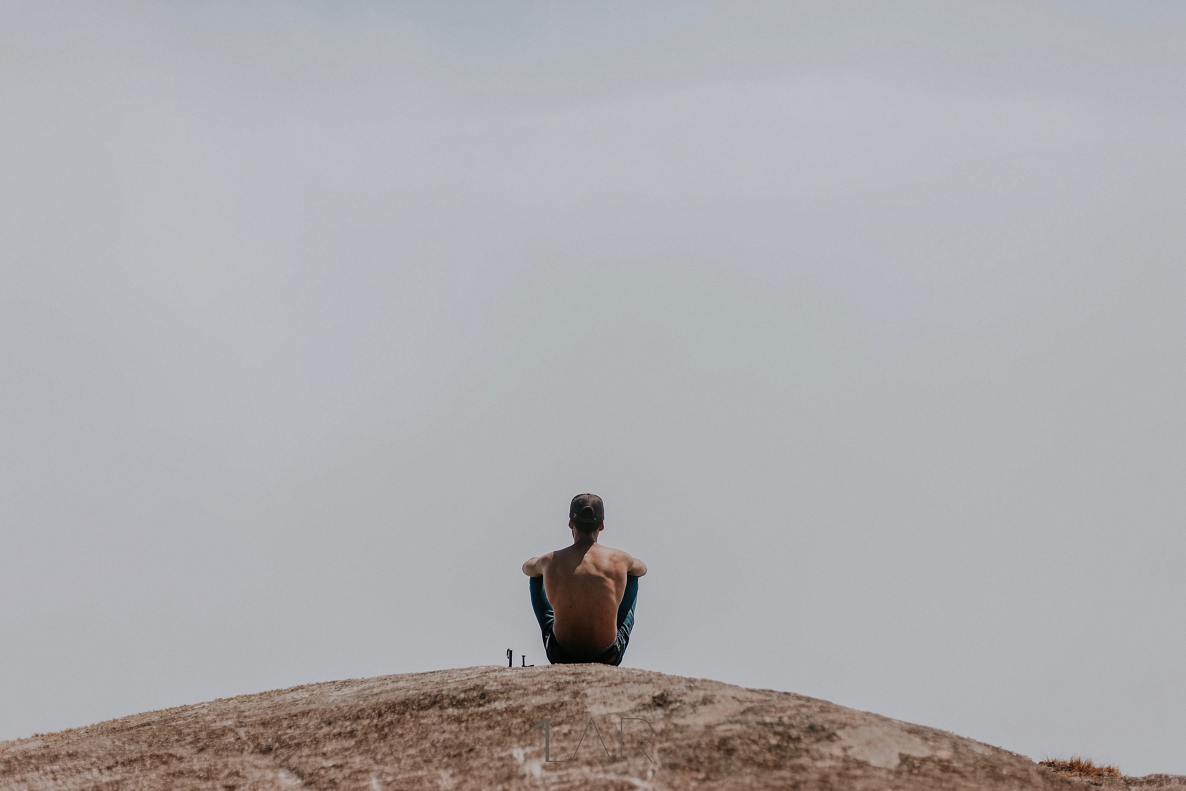 Man Sitting on Ground, action, adult, back view, daylight, dusk