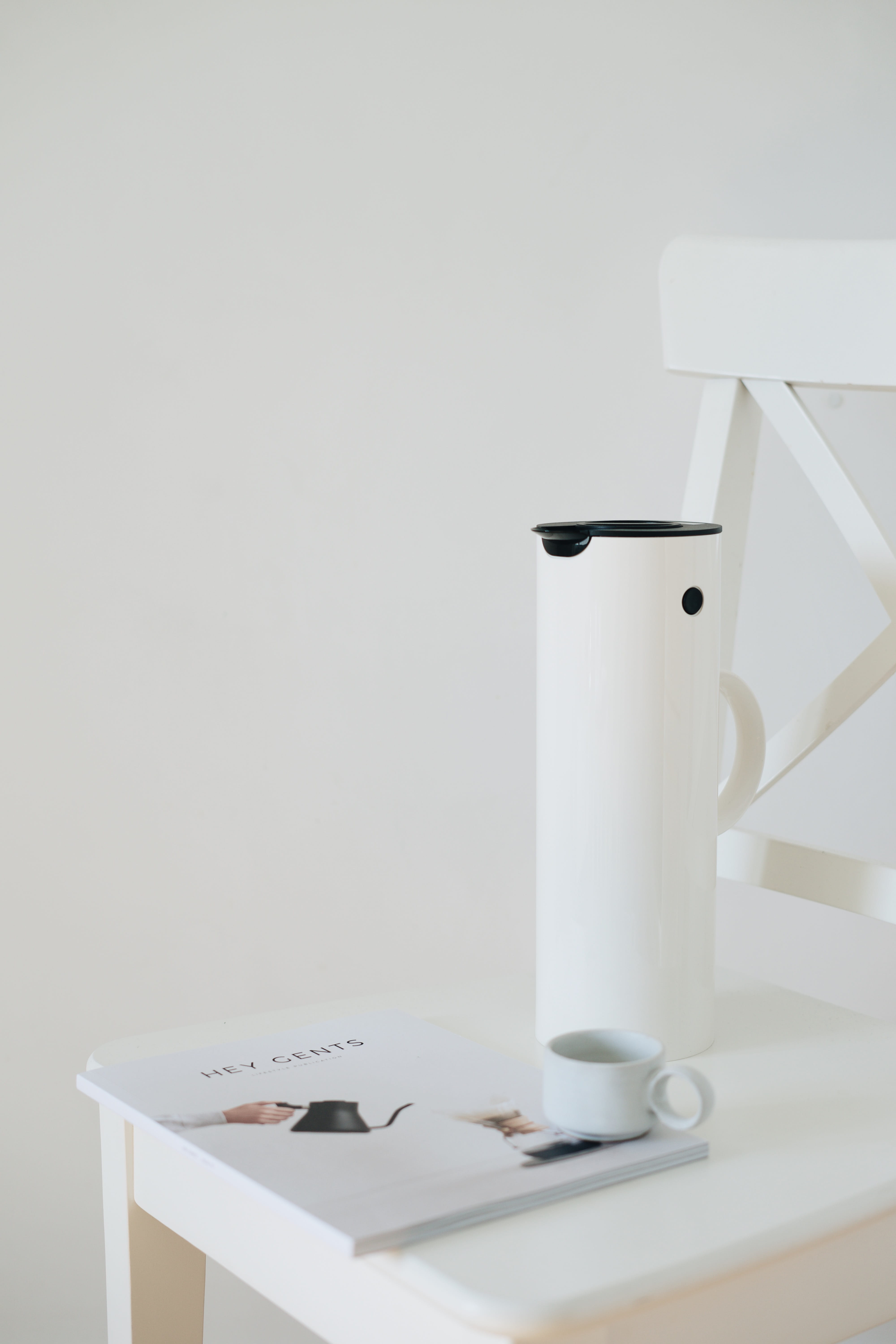 white plastic pitcher, indoors, still life, table, copy space