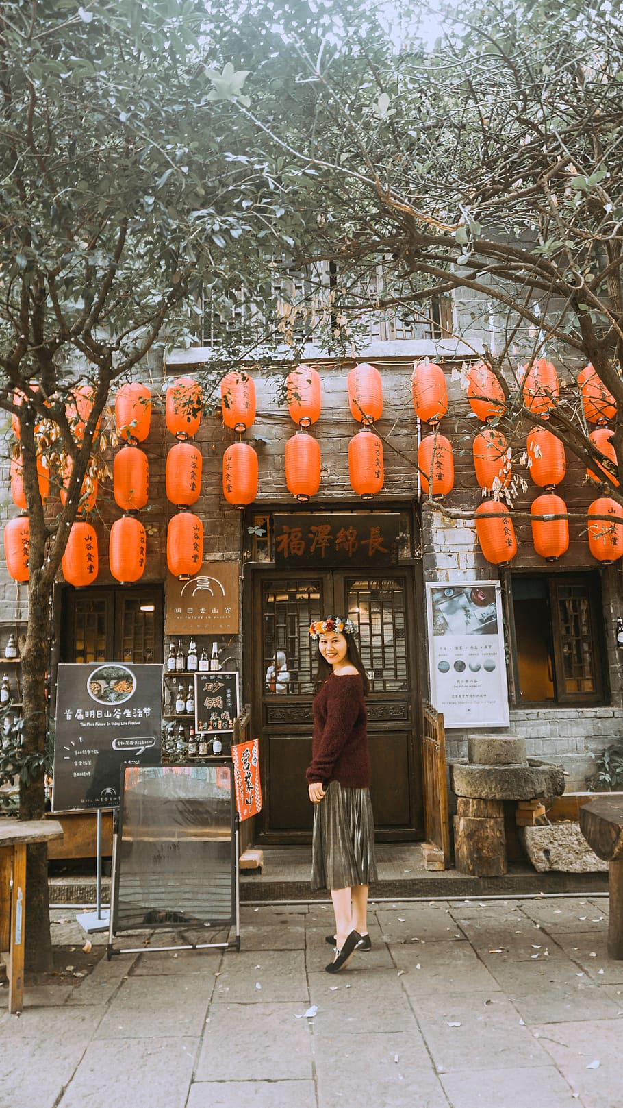 woman standing near orange lantern and wooden door outdoors, apparel, HD wallpaper