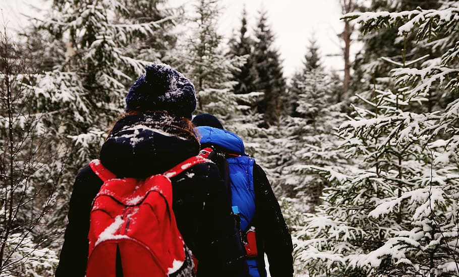 Two People Wearing Jacket And Red Backpack During Winter Season HD wallpaper