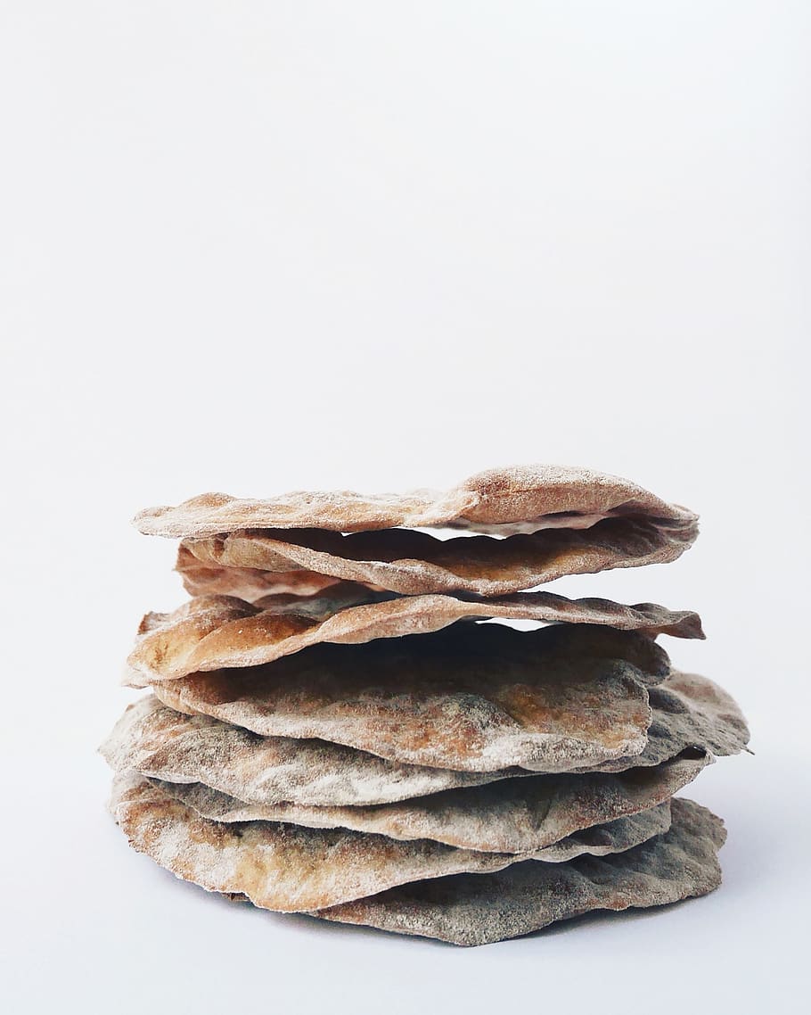 stack of flatbreads, white background, studio shot, still life HD wallpaper