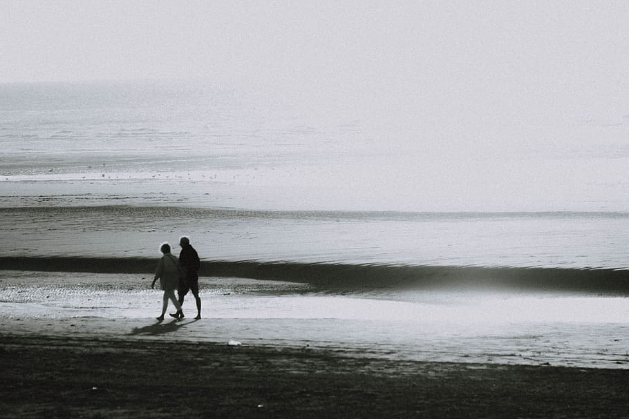 two person walking on seashore, water, beach, two people, land HD wallpaper