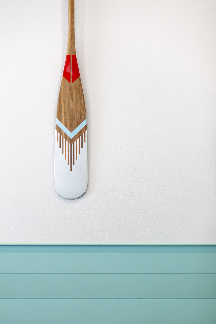 brown, teal, and gray wooden paddle on gray wall, oar, tribal HD wallpaper