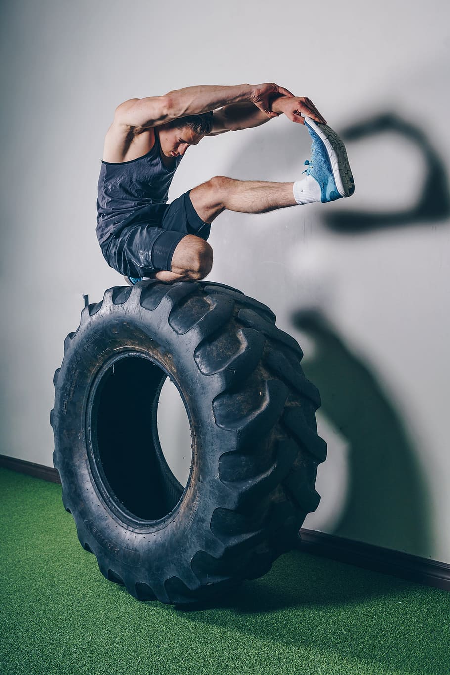 Stretching On Tire Photo, Fitness, Men, Sports, Gym, Exercise