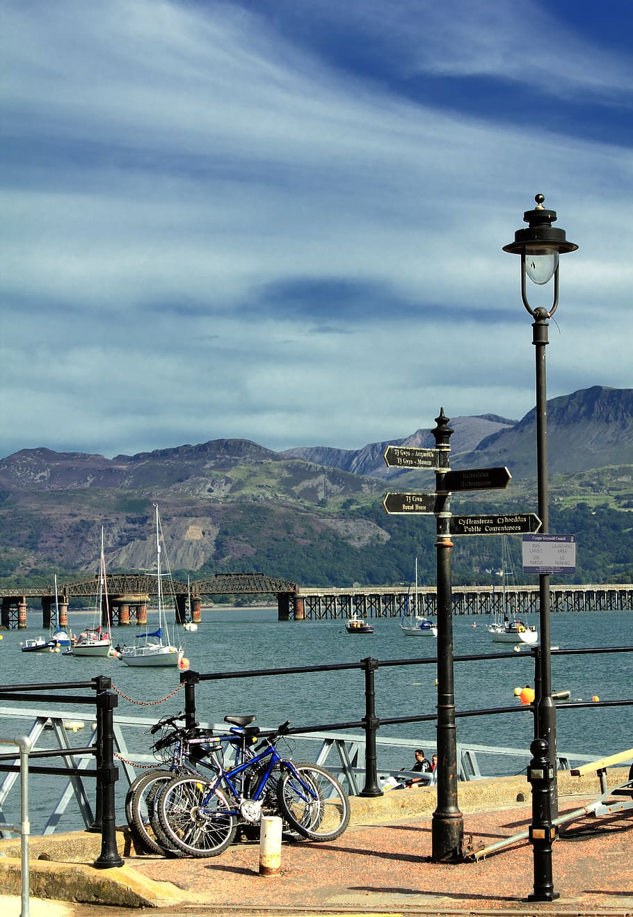 Three Bicycled Parked Near Terrace, boating, boats, bridge, clouds HD wallpaper