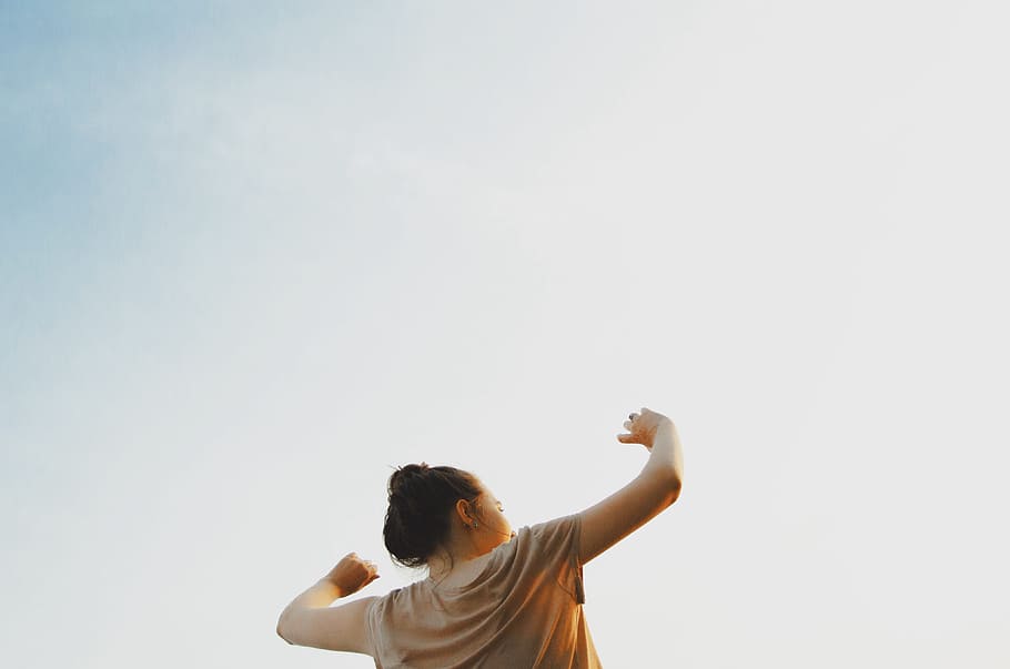 woman standing wearing gray shirt, dance, sunset, movement, portrait HD wallpaper