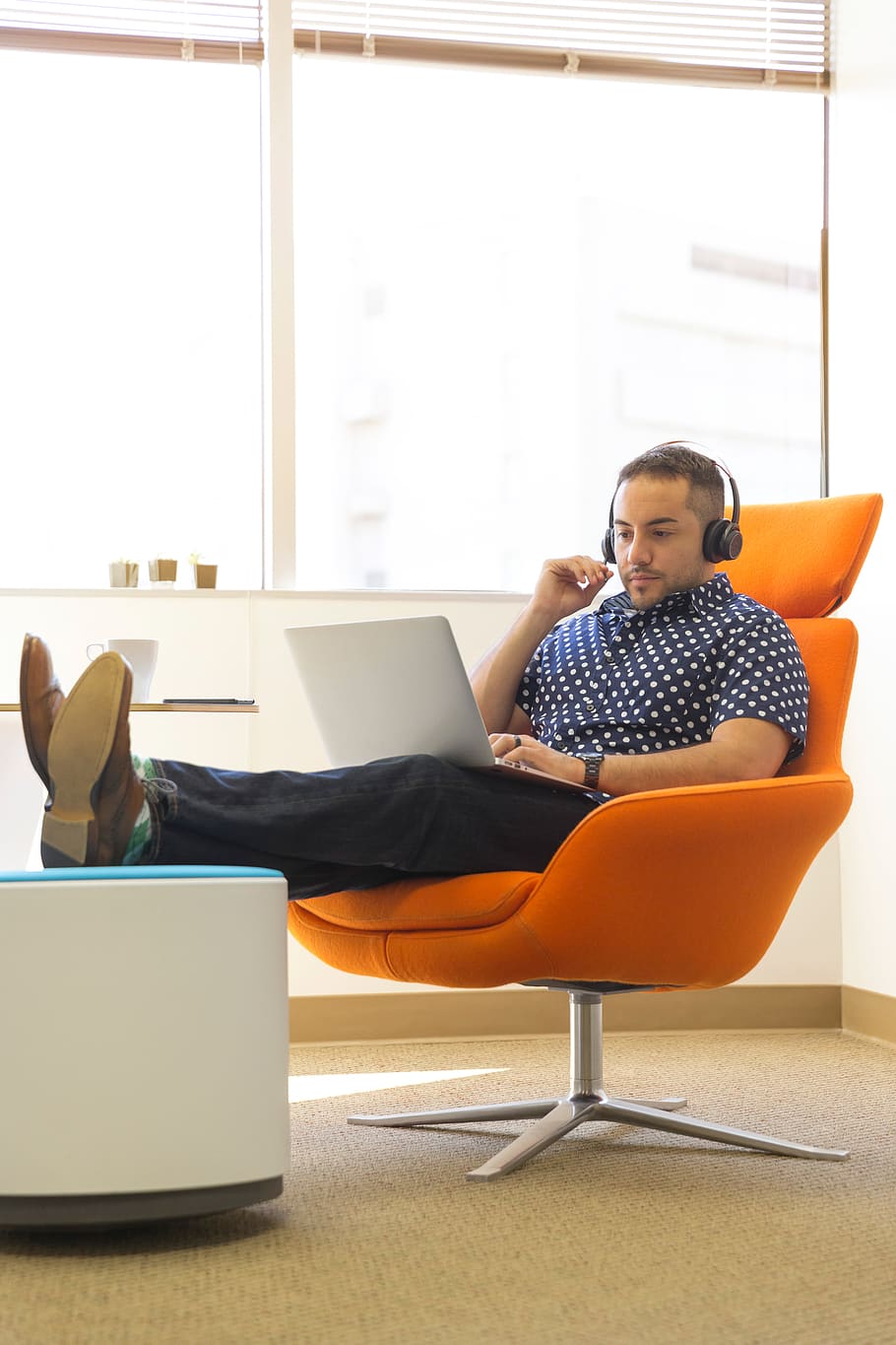 Man Wearing Headphones Sitting on Orange Padded Chair While Using Laptop Computer, HD wallpaper
