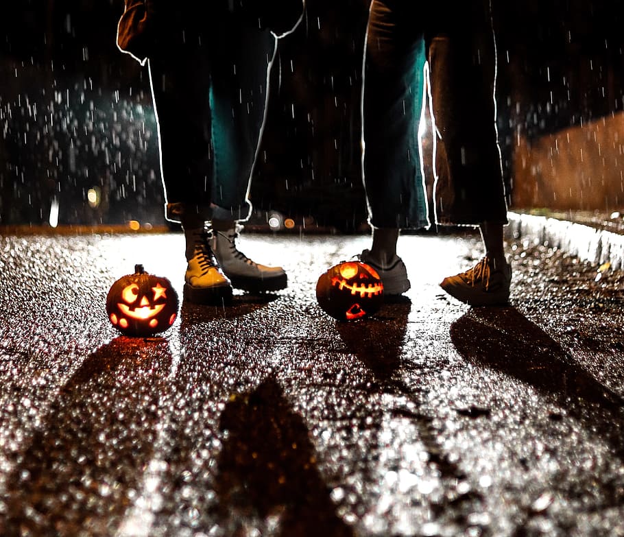 two people standing near Jack-O Lanterns, candle, night, pumpkin, HD wallpaper