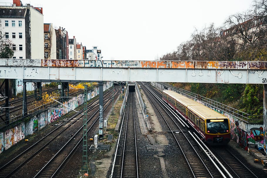 Graffiti walls near a train subway bridge and tracks, architecture