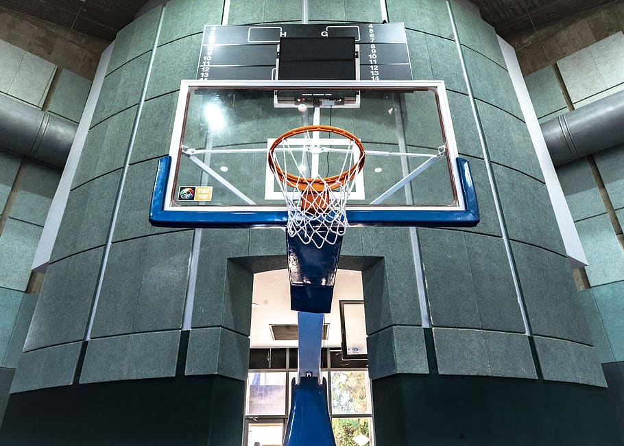 orange basketball hoop with clear glass backboard, building, office building