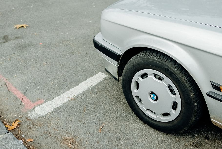 silver BMW vehicle parking during daytime, wheel, machine, tire