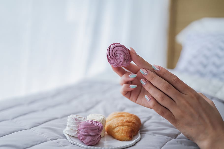 person holding cupcake, human, croissant, kiev, ukraine, food HD wallpaper