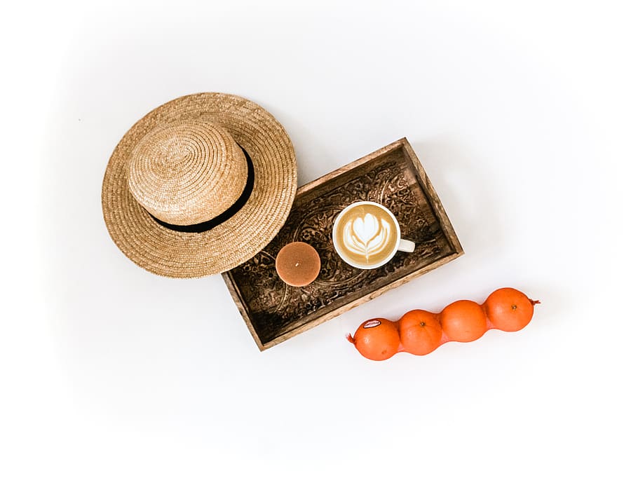 brown wicker hat besides white coffee mug, studio shot, coin HD wallpaper