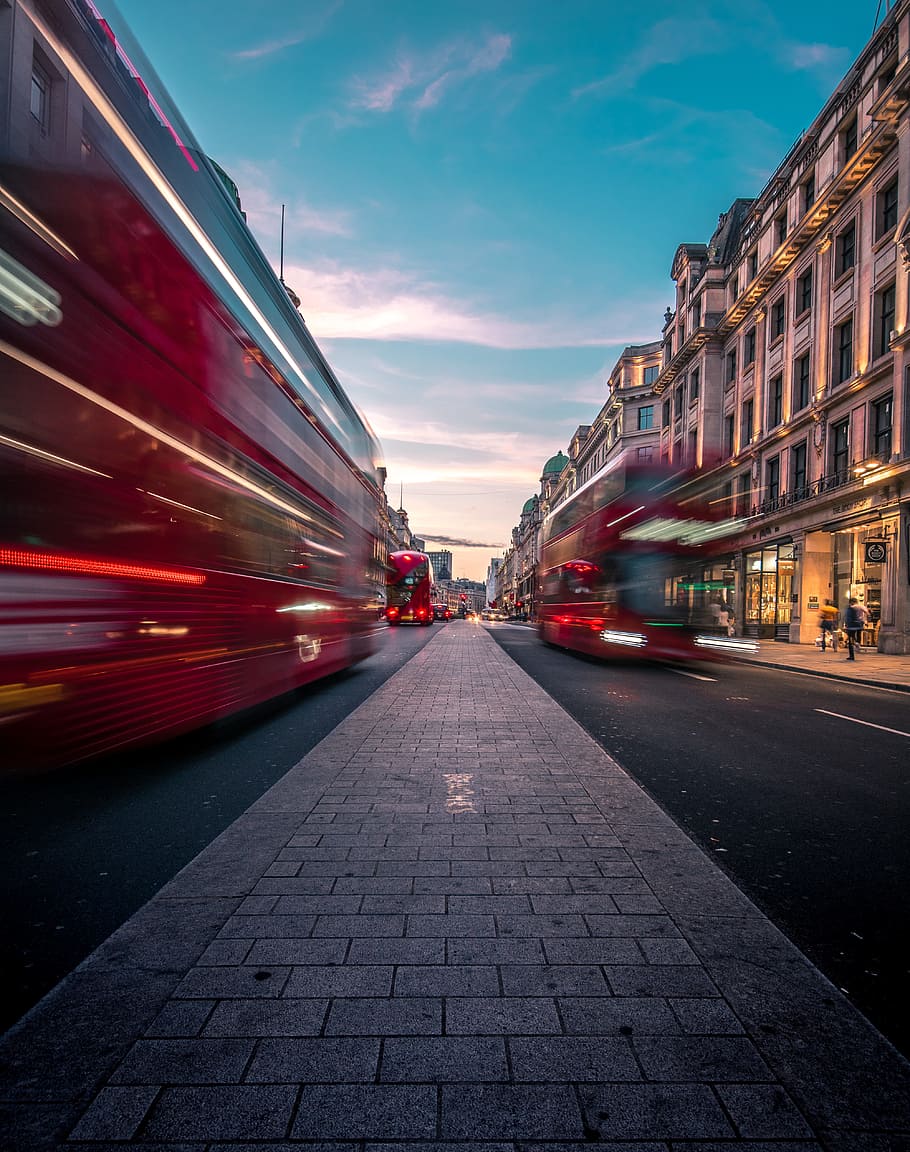 timelapse photography of double decker bus on road between buildings, HD wallpaper