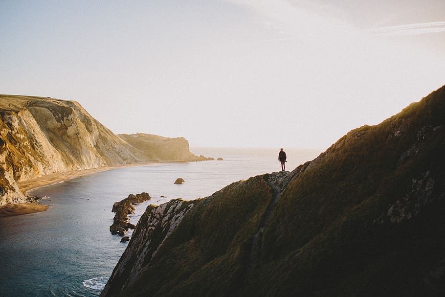 people, man, alone, silhouette, sunny, sunset, ocean, sea, mountain HD wallpaper