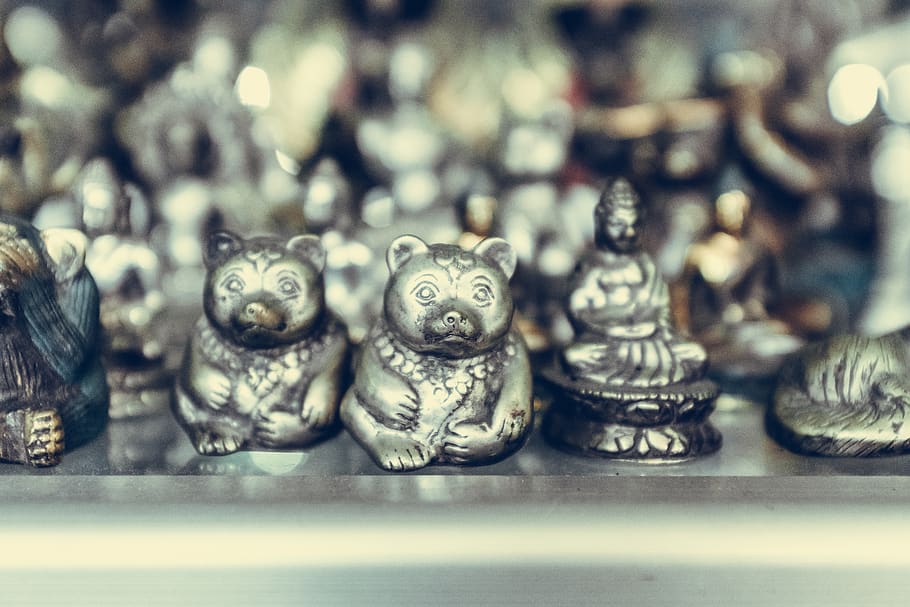 close-up photography of silver-colored bear and Buddha figurines, HD wallpaper