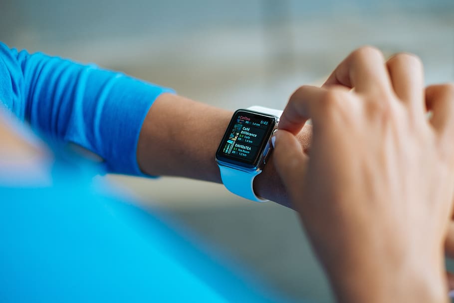Person in Blue Long Sleeve Shirt Using Smart Watch, apple, gadget HD wallpaper