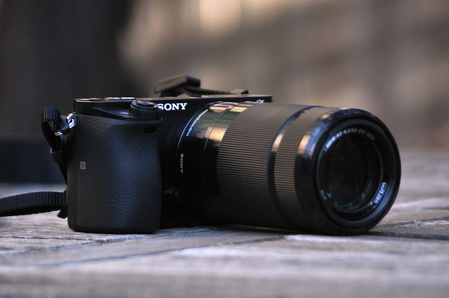 selective focus photography of Sony DSLR camera, electronics