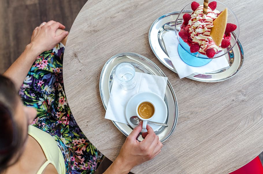 Person Sitting in Front of Wooden Table While Holding Teacup on Tray HD wallpaper