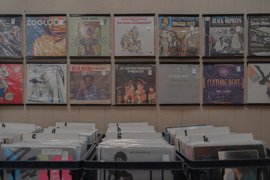assorted posters on rack and wall, indoors, no people, table HD wallpaper