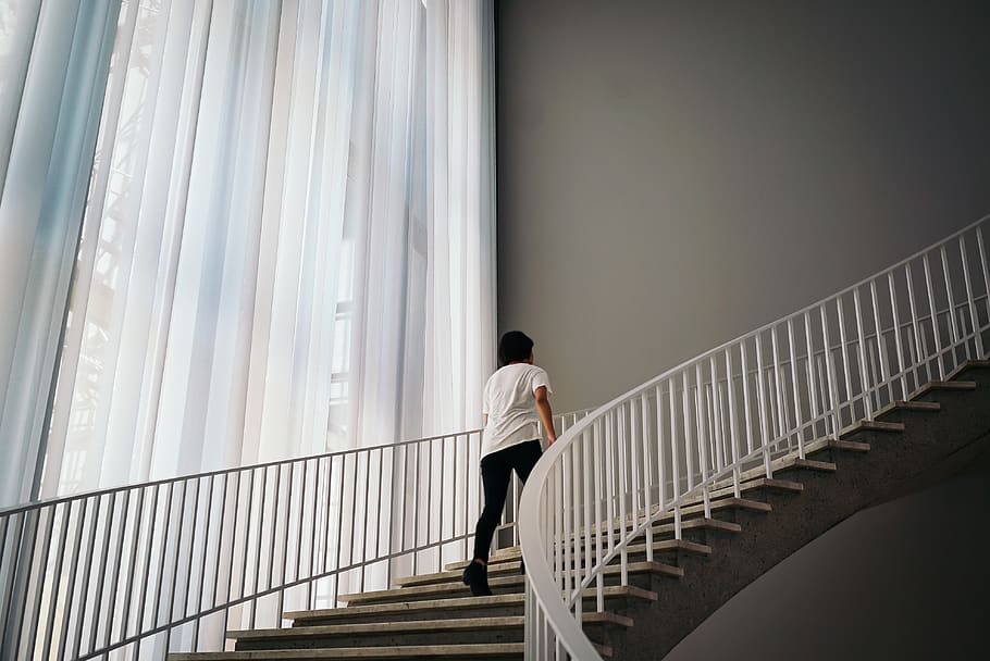 Person Walking On Stairs Inside Building, architecture, indoors HD wallpaper