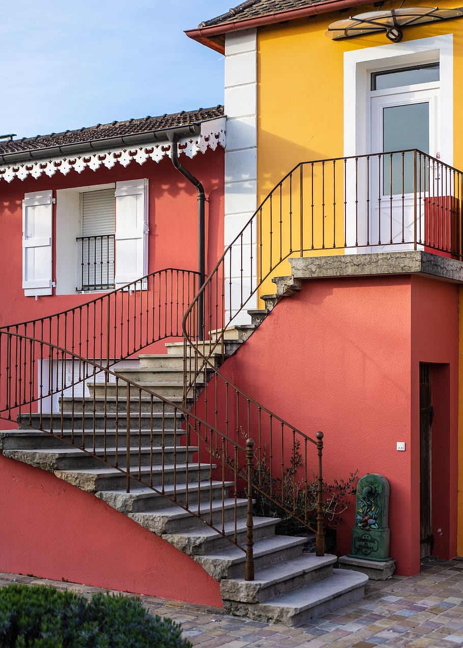 orange, red, and white concrete house, banister, handrail, railing