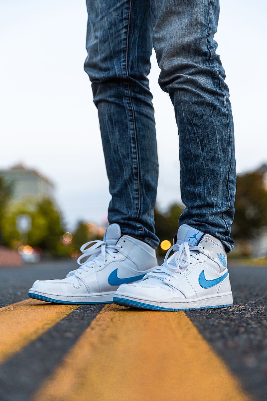 Person Wearing White And Blue Air Jordan 1's, feet, footwear