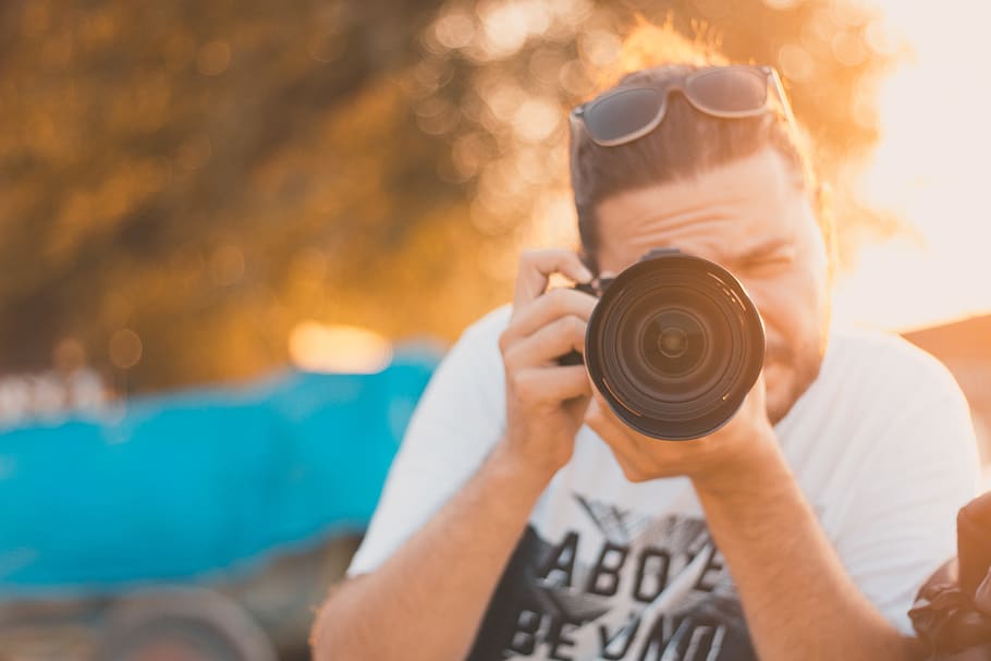 Man Takes Photo With Camera, camera lens, close-up, dslr, leisure HD wallpaper