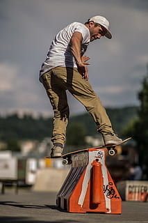 Person Doing Trick on Skateboard, action, balance, blurred background HD wallpaper