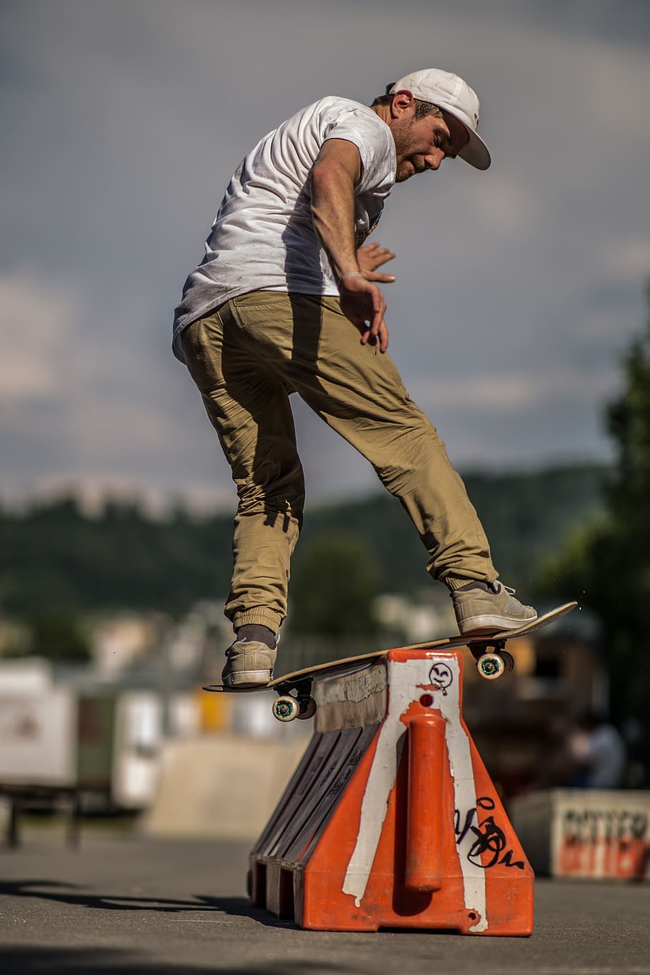 Person Doing Trick on Skateboard, action, balance, blurred background