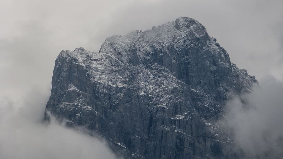 grey mountain under cloudy sky during daytime, fog, snow-capped