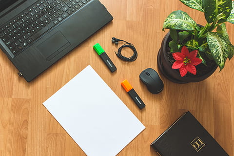 Black Laptop Computer Near White Paper on Brown Wooden Surfac HD wallpaper