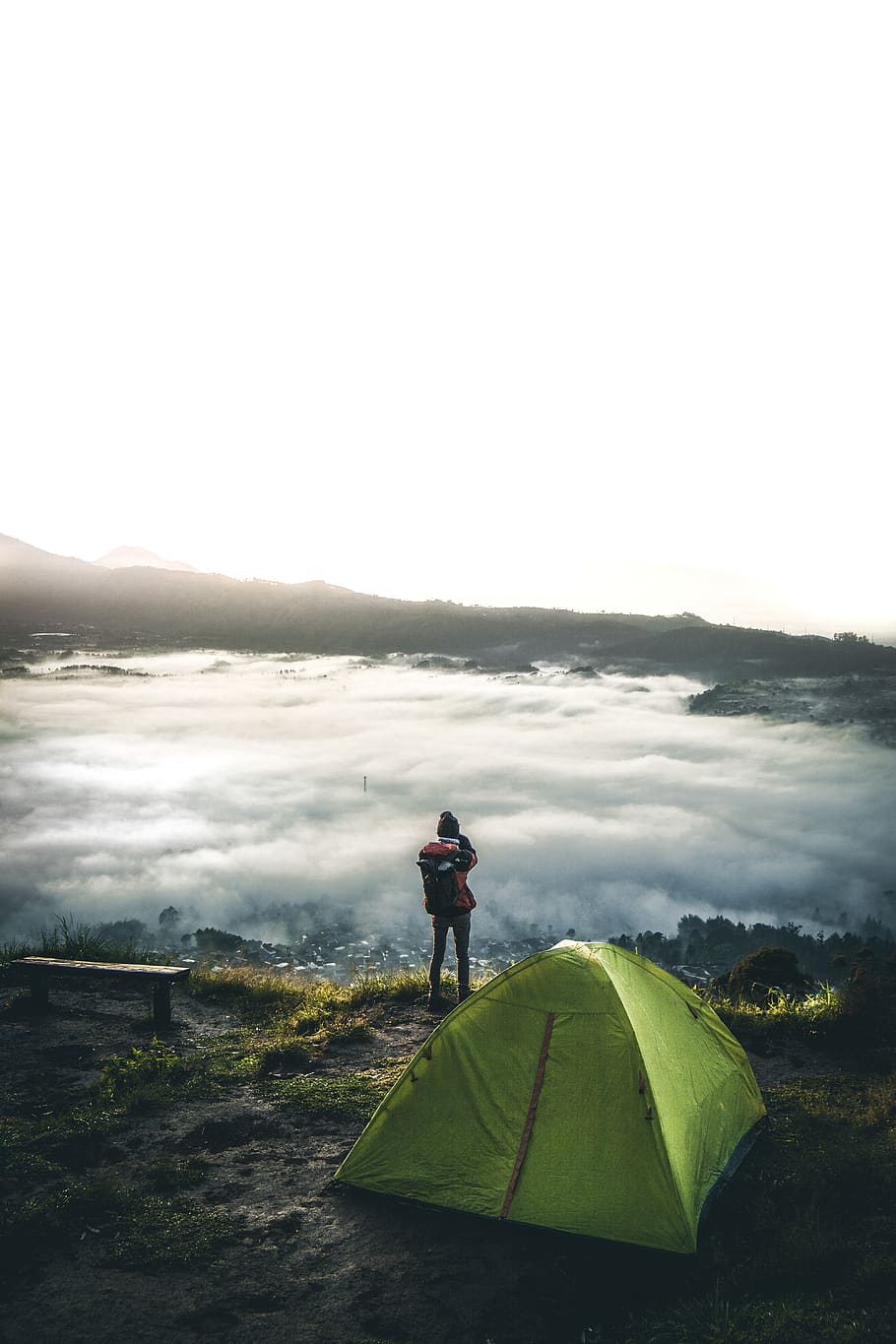 person standing beside tent overlooking white clouds, human, camping