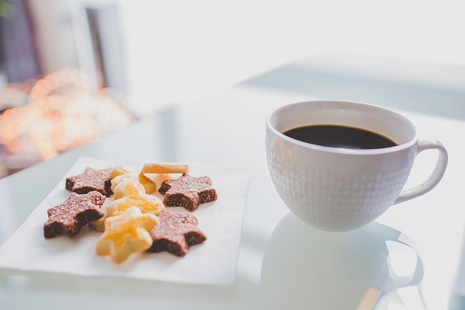White Tea Cup Beside White Square Saucer With Star Shaped Cookies HD wallpaper
