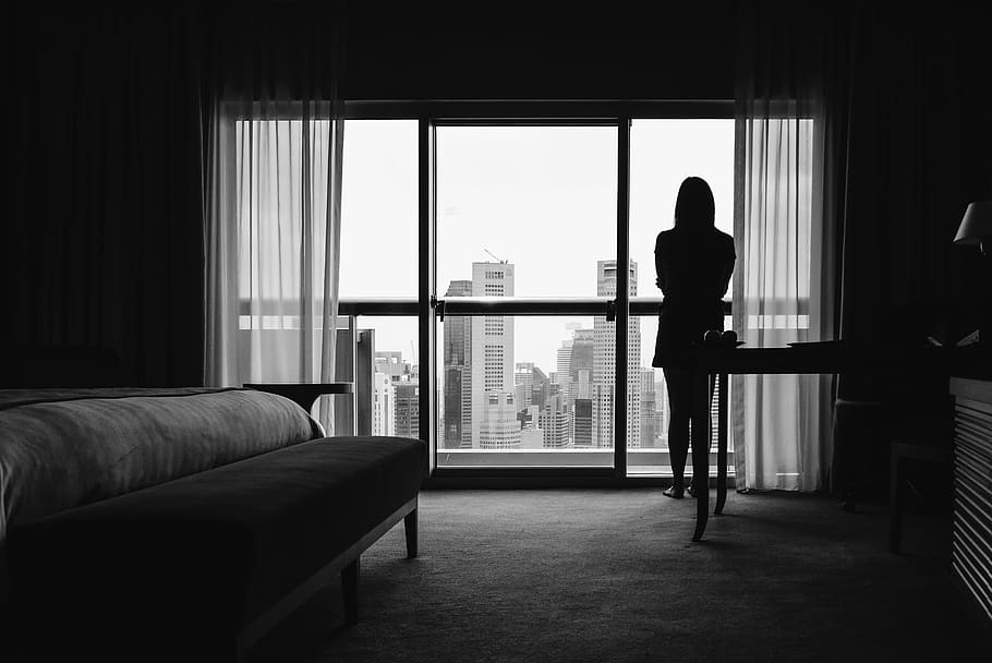 silhouette of woman standing on veranda, couch, furniture, human