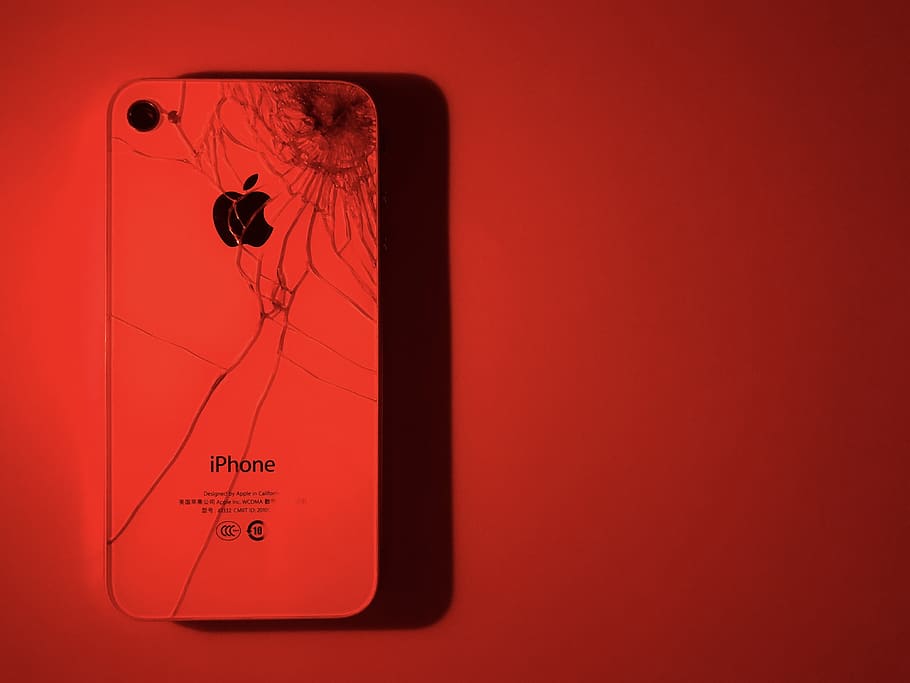 white iPhone under red light, no people, copy space, colored background HD wallpaper